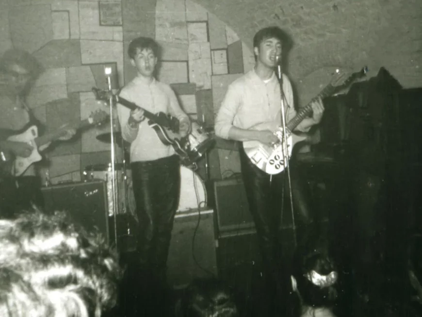 The Beatles performing live at The Cavern Club in Liverpool, featuring John Lennon, Paul McCartney and George Harrison during the band’s early Cavern gigs.